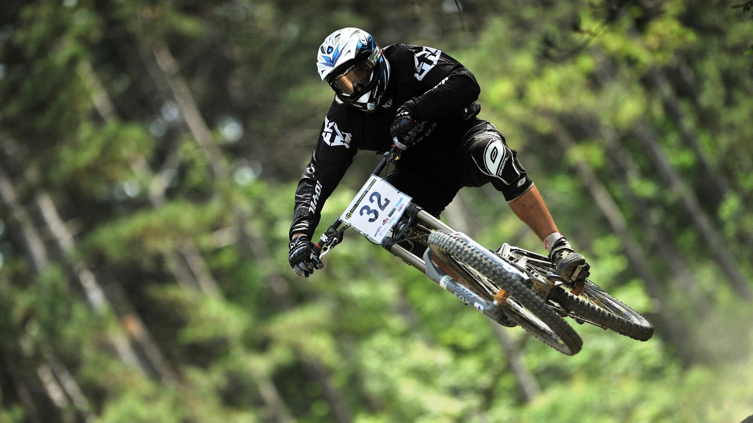 BMX rider catching air on a dirt jump